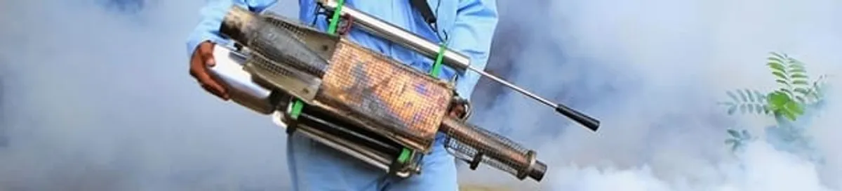 Fumigation technician using a fogger for deep pest treatment in Sioux Falls, SD